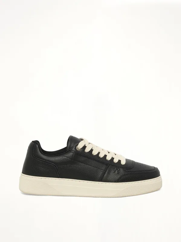 Initial Sneaker in Black sold by MARAIS