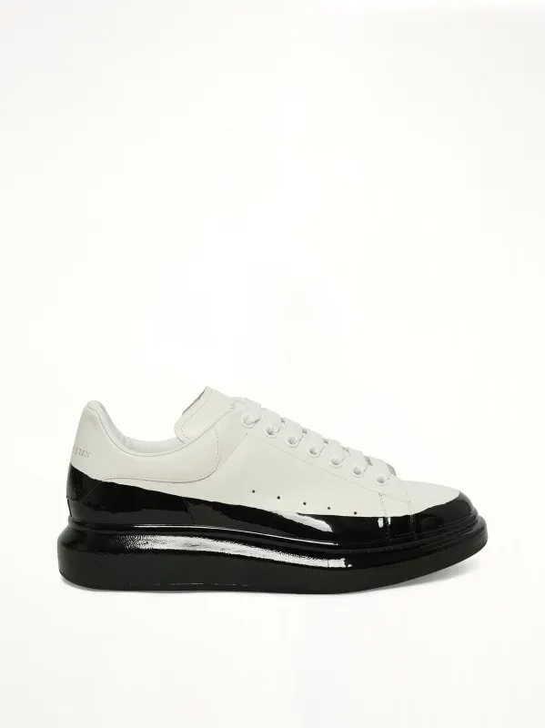 Larry Oversized Dipped Sneaker in White/Black sold by MARAIS