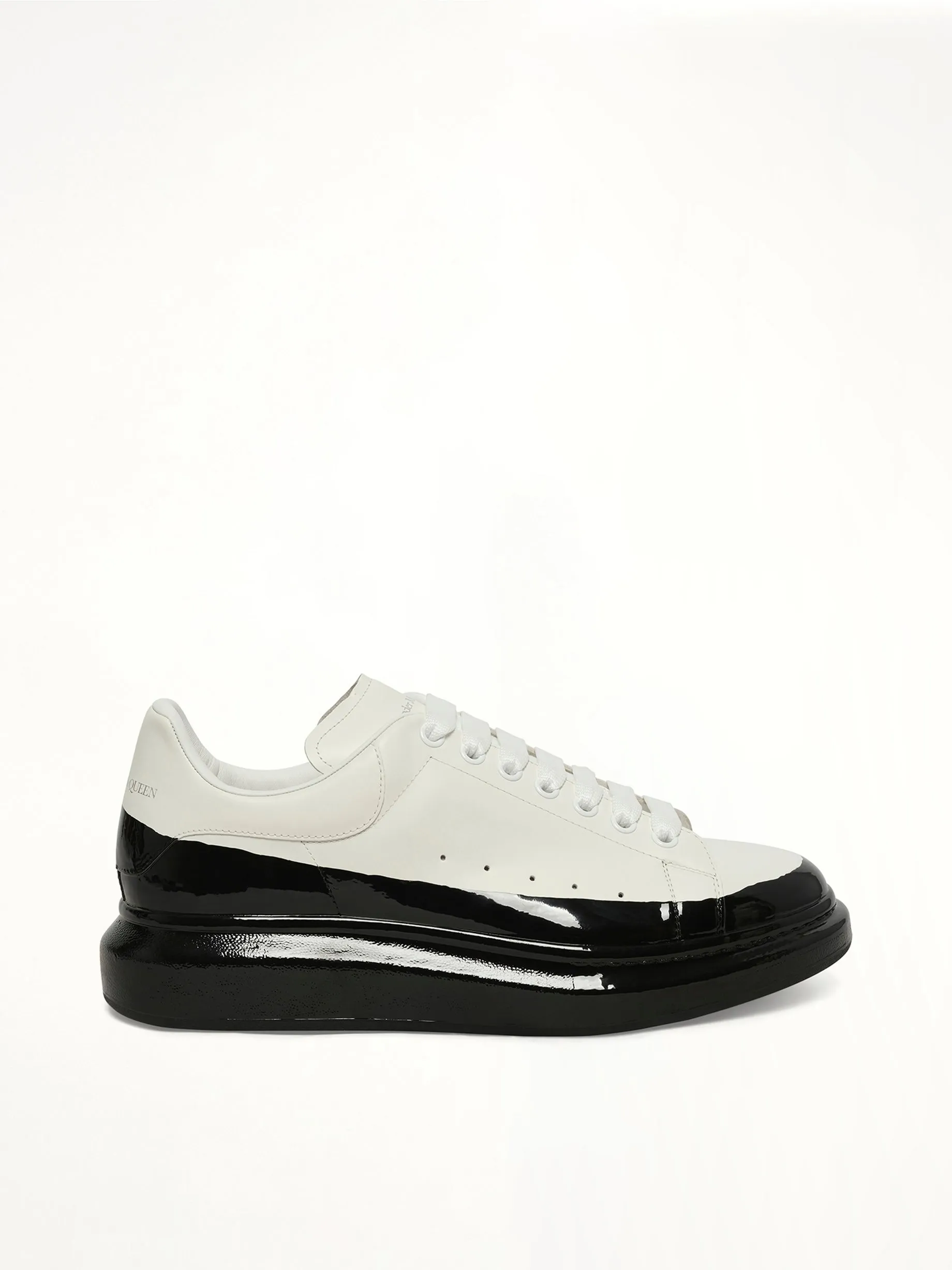Larry Oversized Dipped Sneaker in White/Black sold by MARAIS