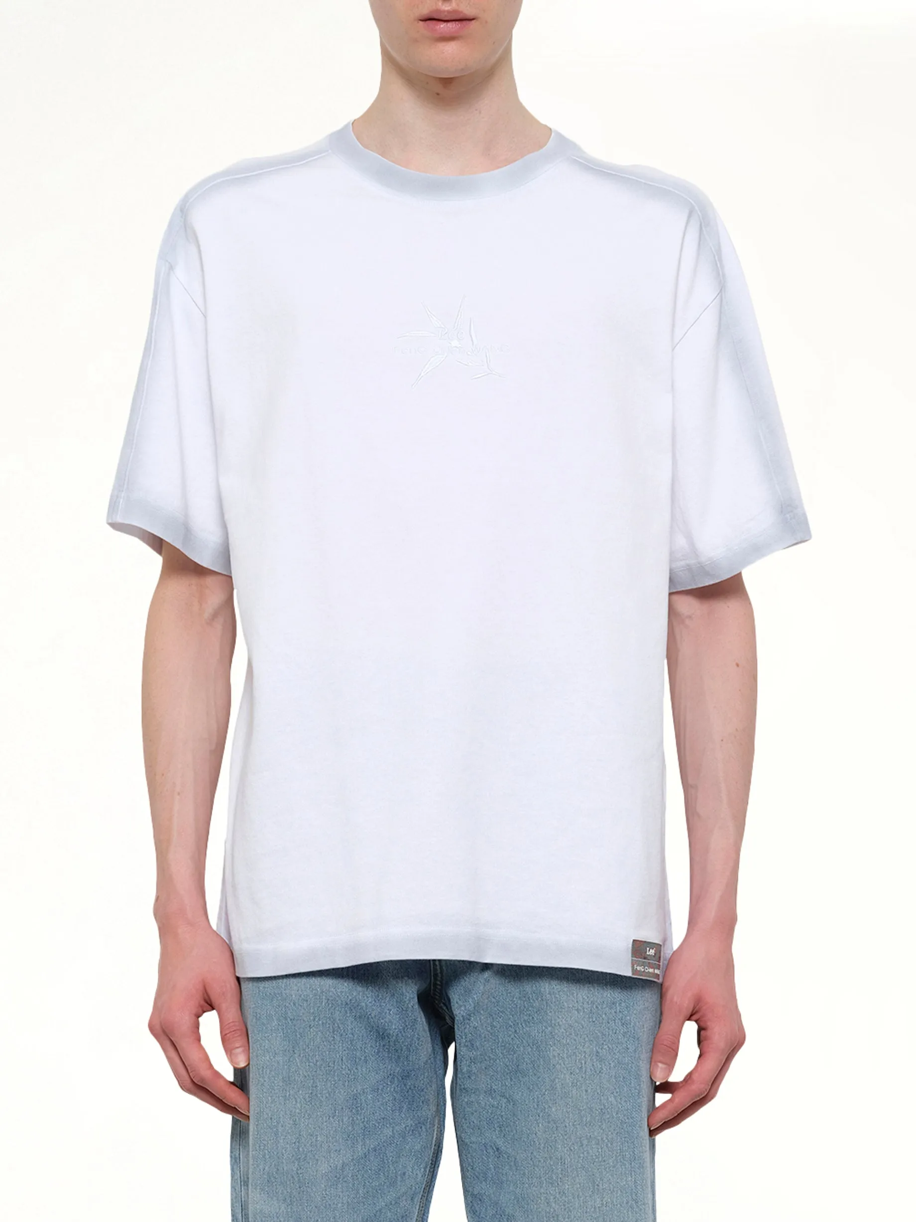 FCW x Lee T-Shirt in White sold by MARAIS