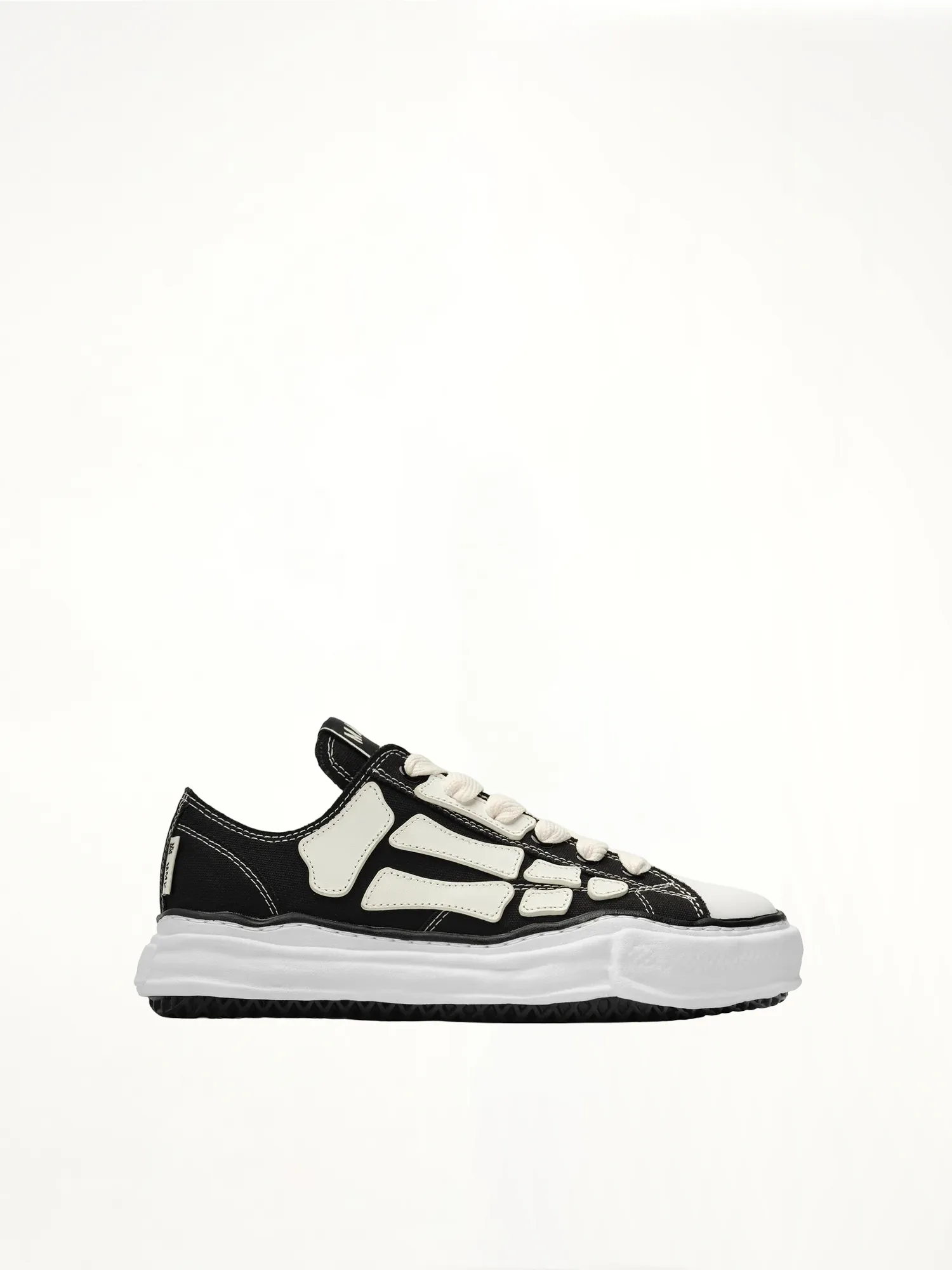 Amiri x MMY Bones Sneaker in Black sold by MARAIS