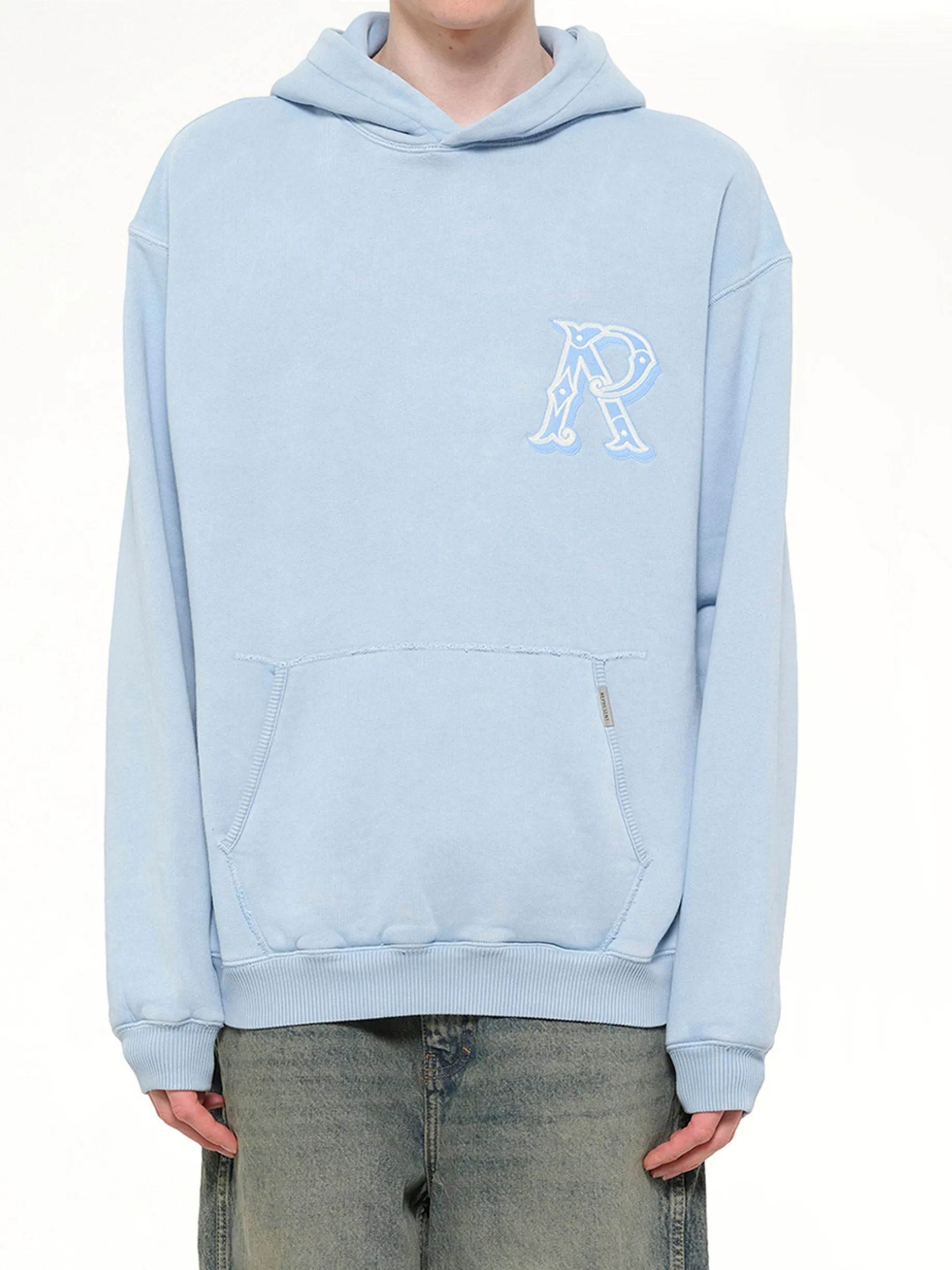 Western Initial Hoodie in Mountain Bluebird sold by MARAIS