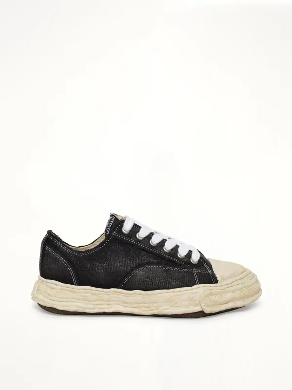 Peterson23 Bleached Canvas Low Top Sneakers in Black made by Maison MIHARA YASUHIRO