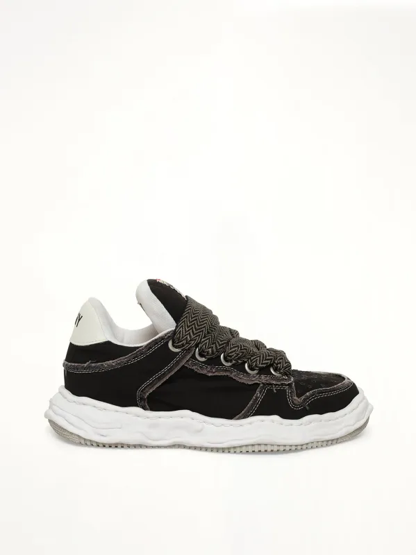 Wayne Puffer Patterned Lace Low Top Sneakers in Black made by Maison MIHARA YASUHIRO