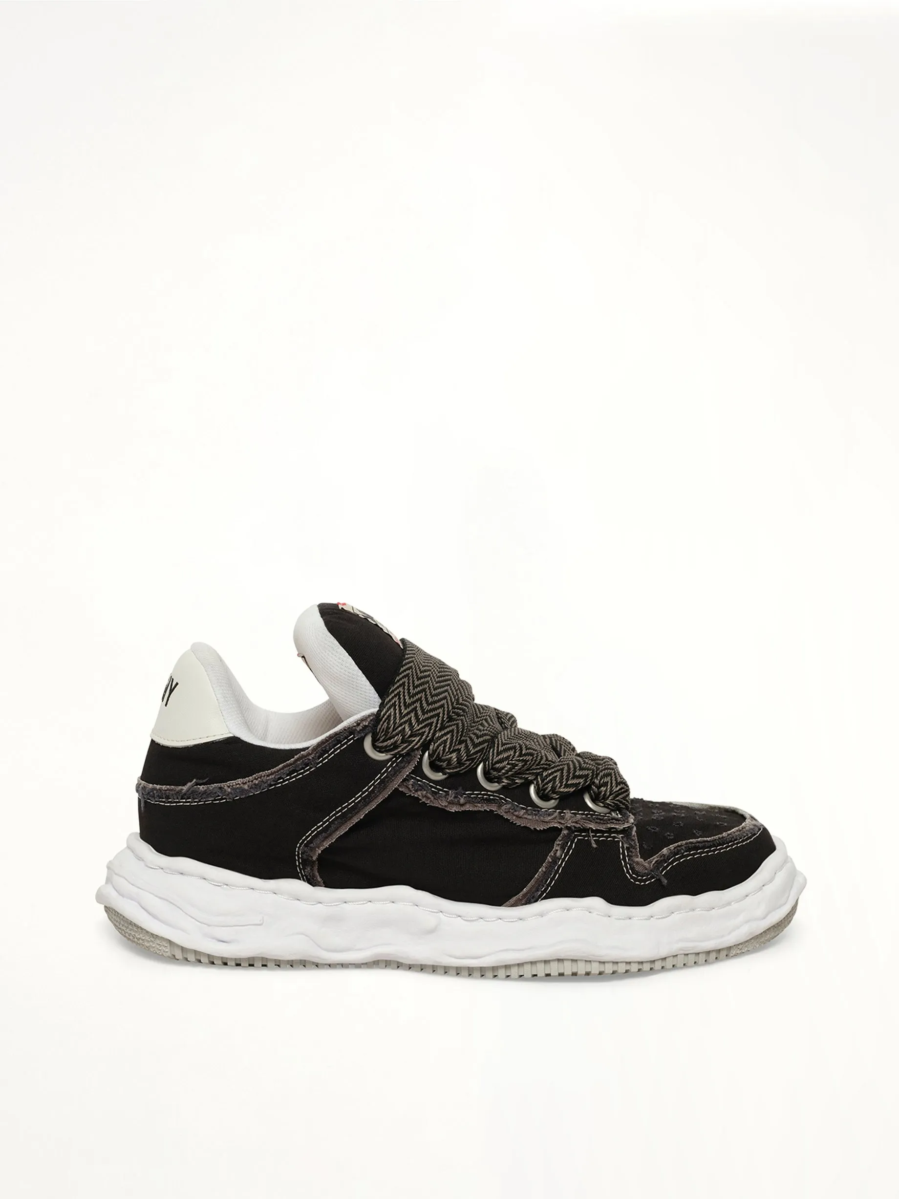 Wayne Puffer Patterned Lace Low Top Sneakers in Black sold by MARAIS