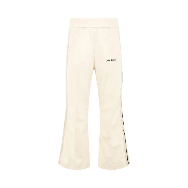 Logo Embroidered Flare Track Pants in Butter sold by MARAIS