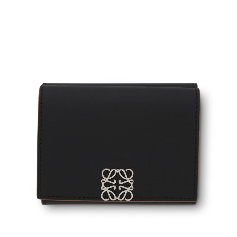 Anagram Trifold Wallet Pebble Grain Calfskin in Black sold by MARAIS