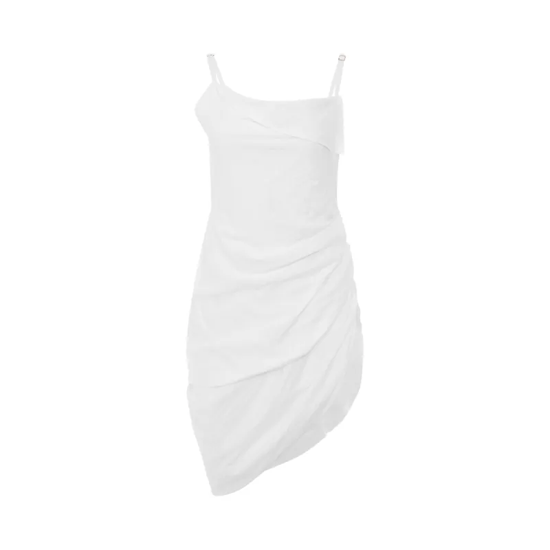 Saudade Asymmetric Draped Mini Dress in White sold by MARAIS