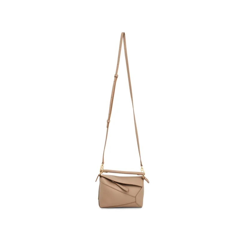 Mini Puzzle Edge Bag in Soft Grained Calf in Sand sold by MARAIS