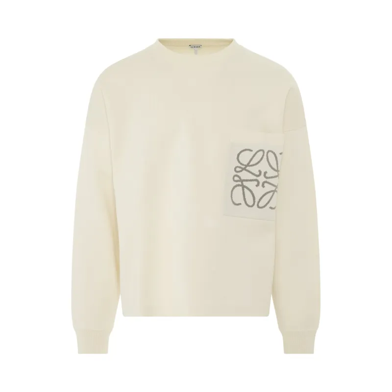 Anagram Pocket Sweater in Soft White sold by MARAIS