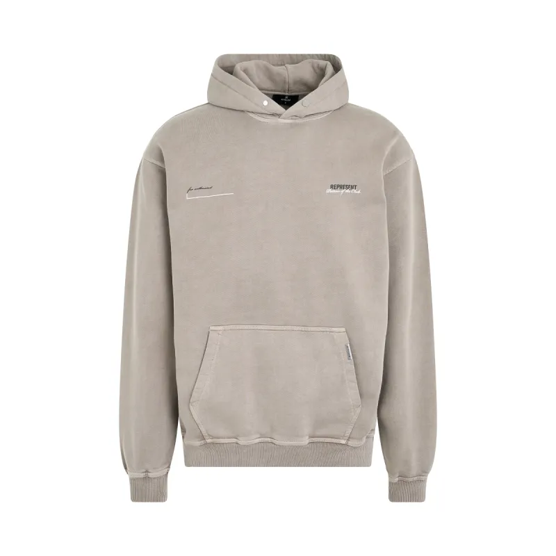 Patron of the Club Hoodie in Mudstone sold by MARAIS