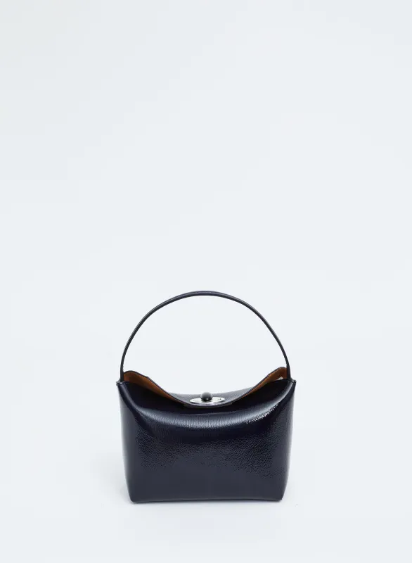 Turnlock Patent Mini Shoulder Bag sold by Christopher Esber