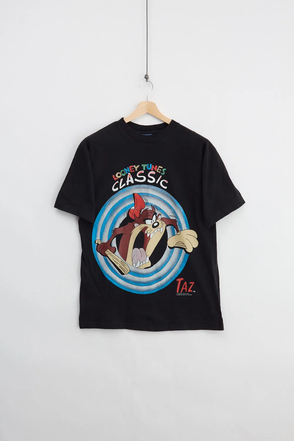 1993 Looney Tunes Taz Tee (L) sold by Livid Jeans