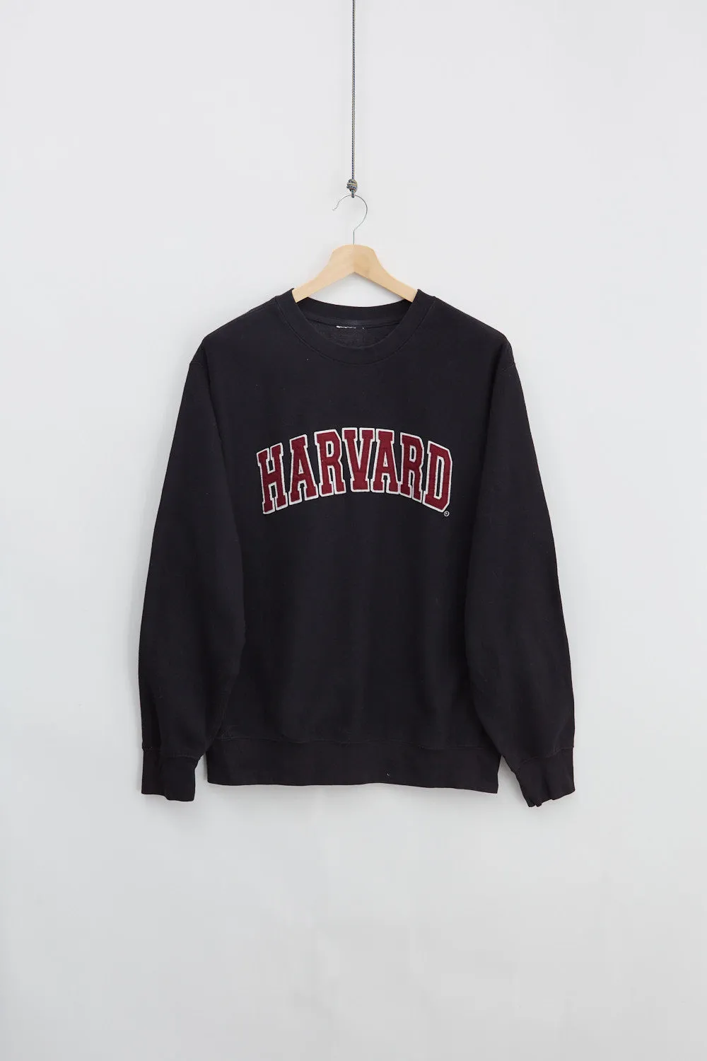 Harvard University Crewneck (L) sold by Livid Jeans