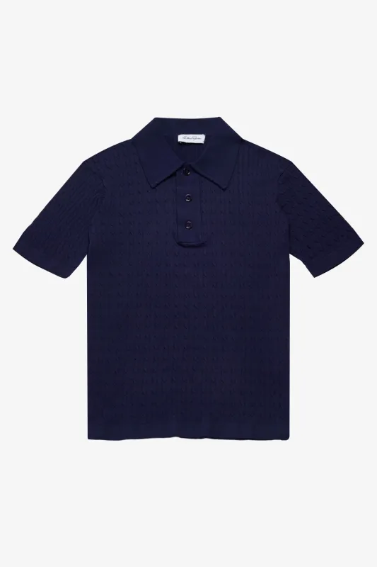 Evan navy knitted cable Polo sold by Anthony Squires