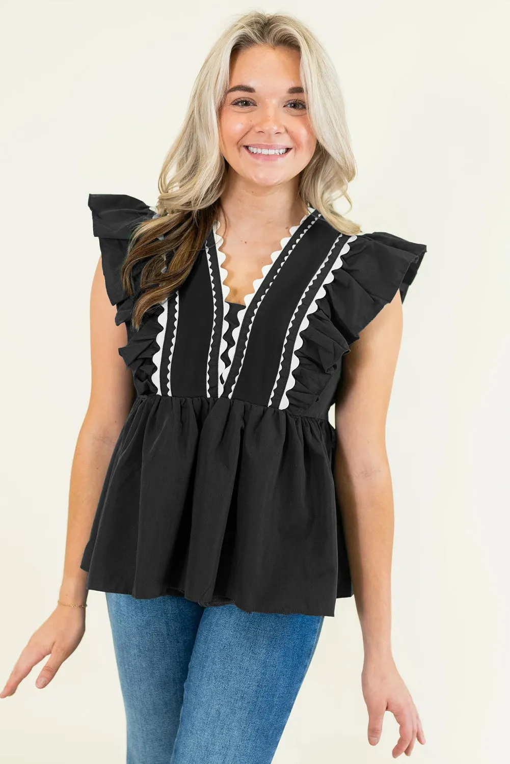 Black Contrast Ricrac Trim Ruffled V Neck Peplum Top sold by Beagle Boutique product image thumbnail 3