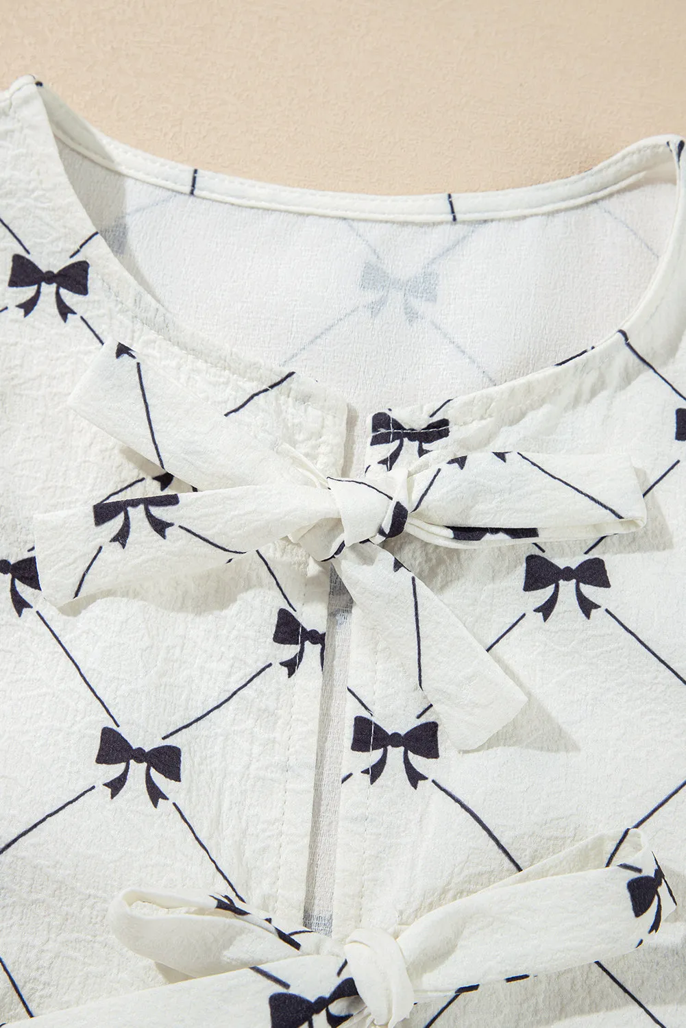 White Bowknot Print Front Knots Bubble Sleeve Blouse sold by Beagle Boutique product image thumbnail 5