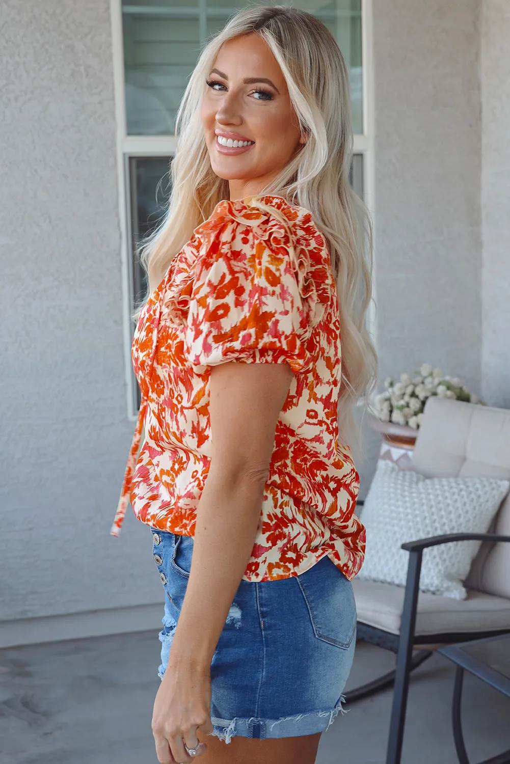 Orange Floral Print Ruffled Short Puff Sleeve Split Neck Blouse sold by Beagle Boutique product image thumbnail 3
