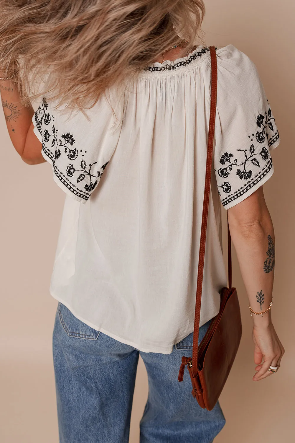 White Floral Embroidered Short Sleeve V Neck Blouse sold by Beagle Boutique product image thumbnail 2