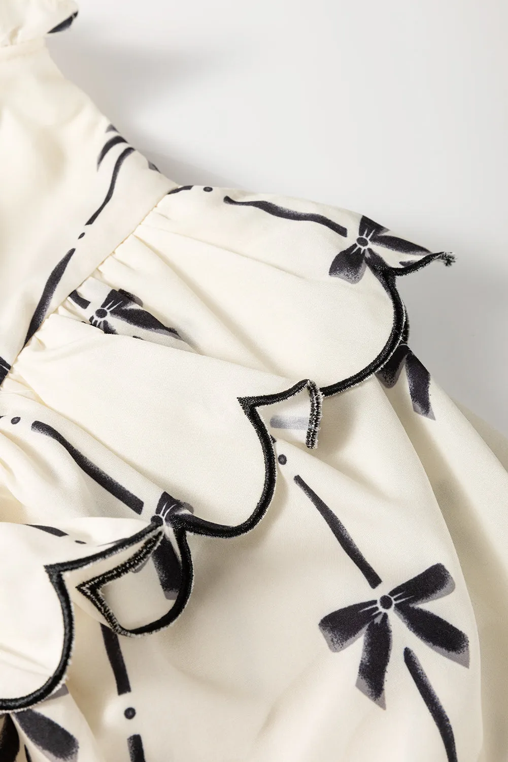 Apricot Bow Printed Ruffled Bubble Sleeve Lace-up Notched Neck Plus Size Blouse sold by Beagle Boutique product image thumbnail 5