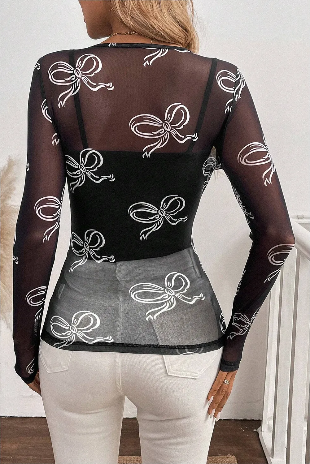 Black Round Neck Bow Print Long Sleeve Mesh Top sold by Beagle Boutique product image thumbnail 2