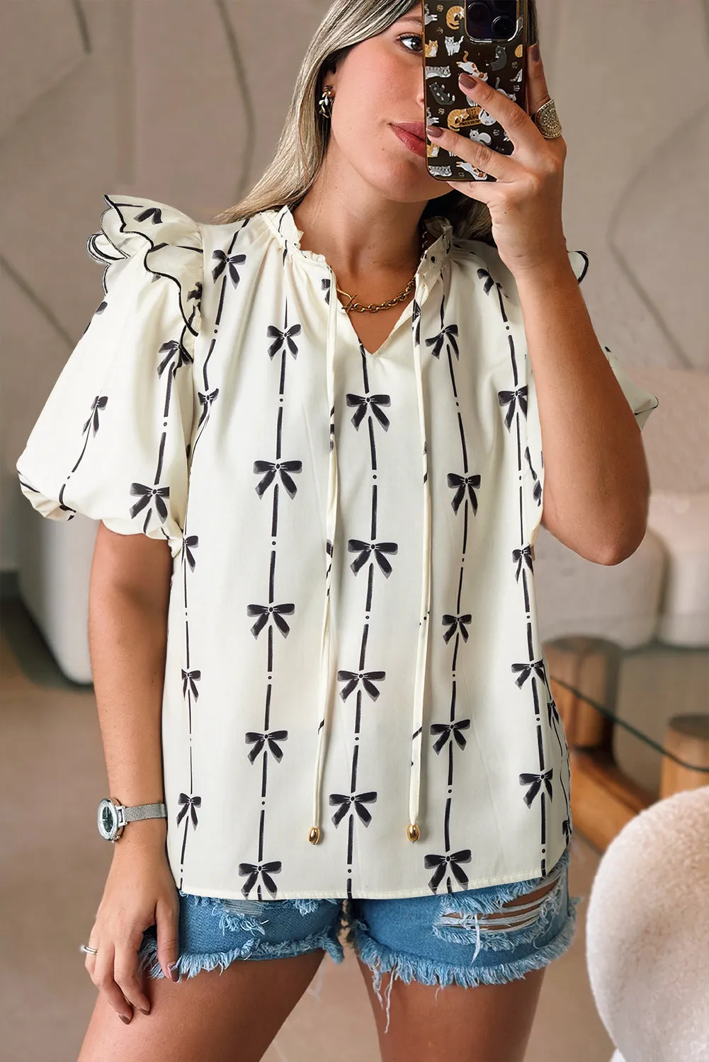 Beige Bow Printed Ruffled Bubble Sleeve Tied Notched V Neck Blouse sold by Beagle Boutique product image thumbnail 5