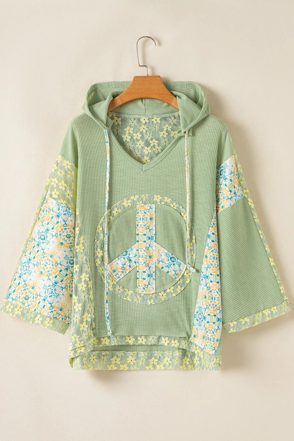 Clearly Aqua Oversized Floral Peace Sign Graphic Patchwork Knit Hooded Top sold by Beagle Boutique
