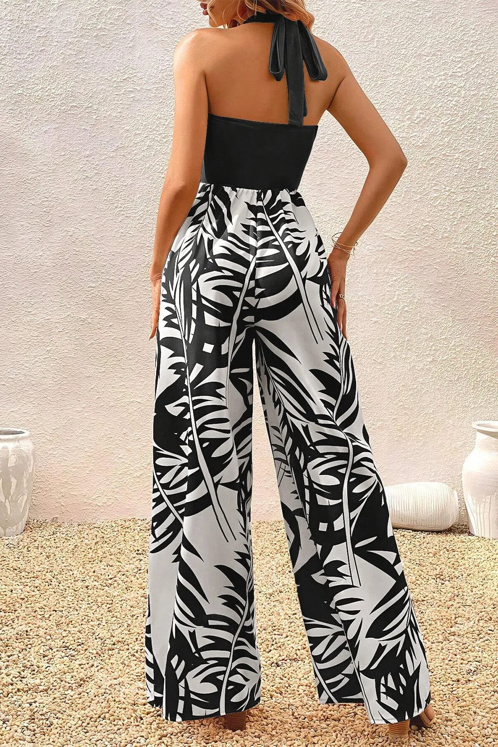 Black Halter Tropical Plant Print Wide Leg Jumpsuit sold by Beagle Boutique product image thumbnail 2