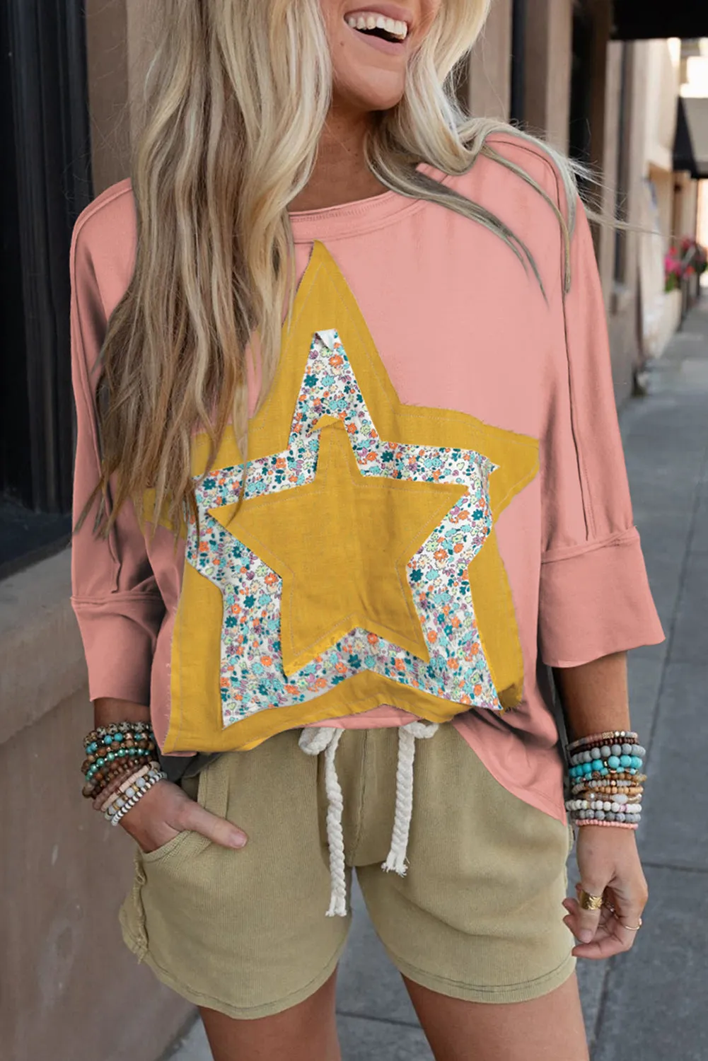 Rose Tan Floral Starbust Exposed Seam Mineral Wash Top sold by Beagle Boutique