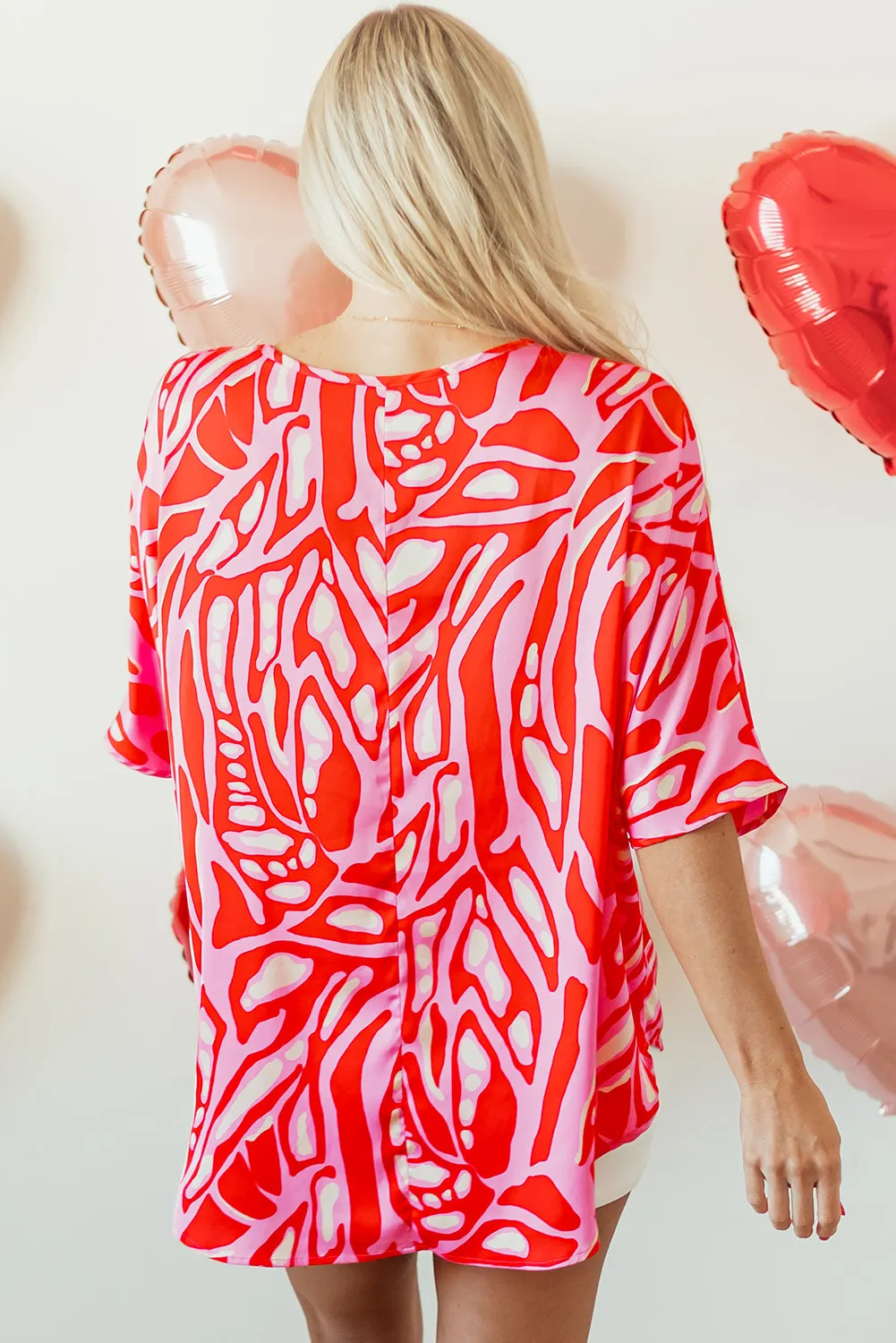 Red Abstract Print V Neck Batwing Sleeve Oversized Blouse sold by Beagle Boutique product image thumbnail 2