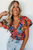 Orange Floral Print Puff Sleeve Ruched V Neck Blouse sold by Beagle Boutique