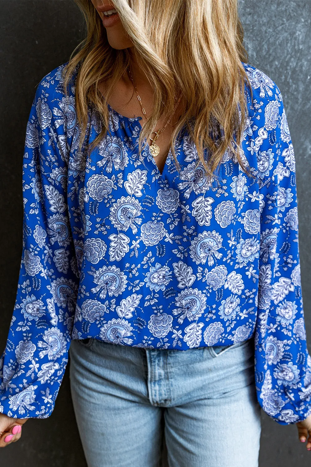 Blue Floral Notched V-Neck Long Sleeve Blouse sold by Beagle Boutique