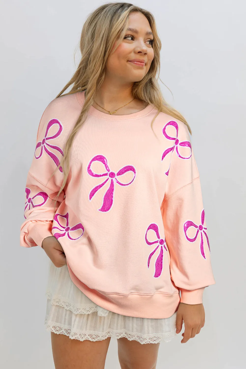 Apricot Pink Sequined Bowknot Drop Shoulder Oversized Sweatshirt sold by Beagle Boutique product image thumbnail 3