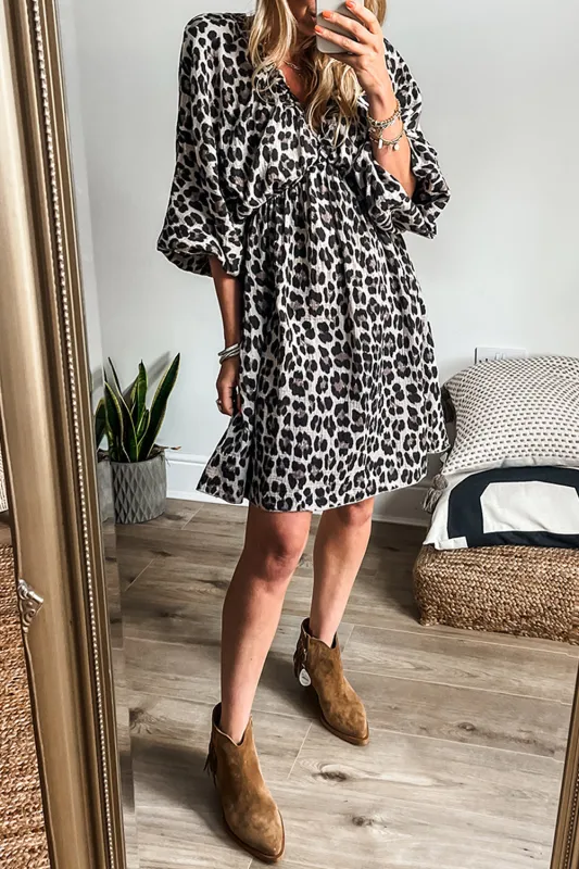 Black Leopard Print Elasticated V Neck 3/4 Puff Sleeve Dress sold by Beagle Boutique