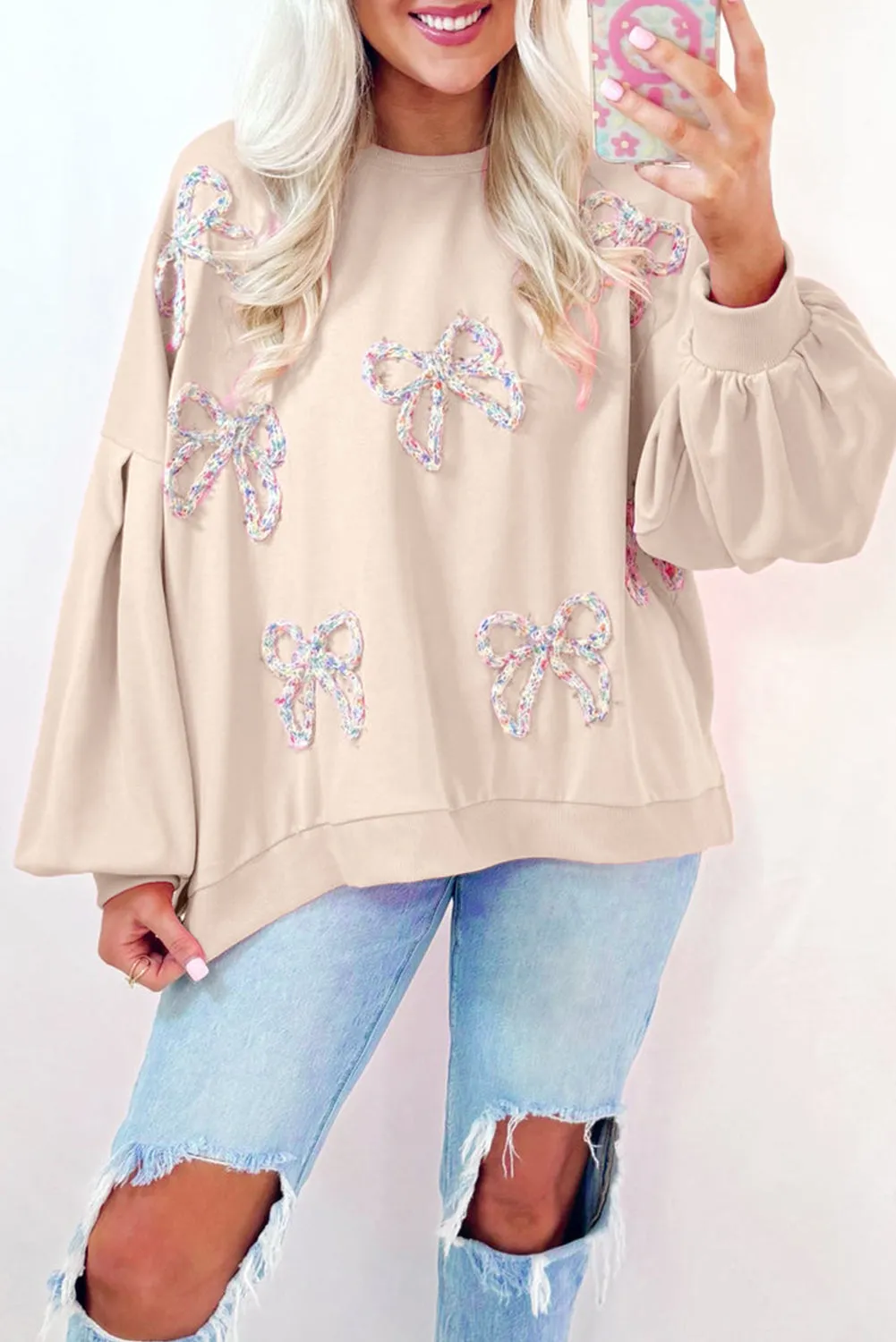 Parchment Embroidered Bow Lantern Sleeve Oversized Pullover Sweatshirt sold by Beagle Boutique