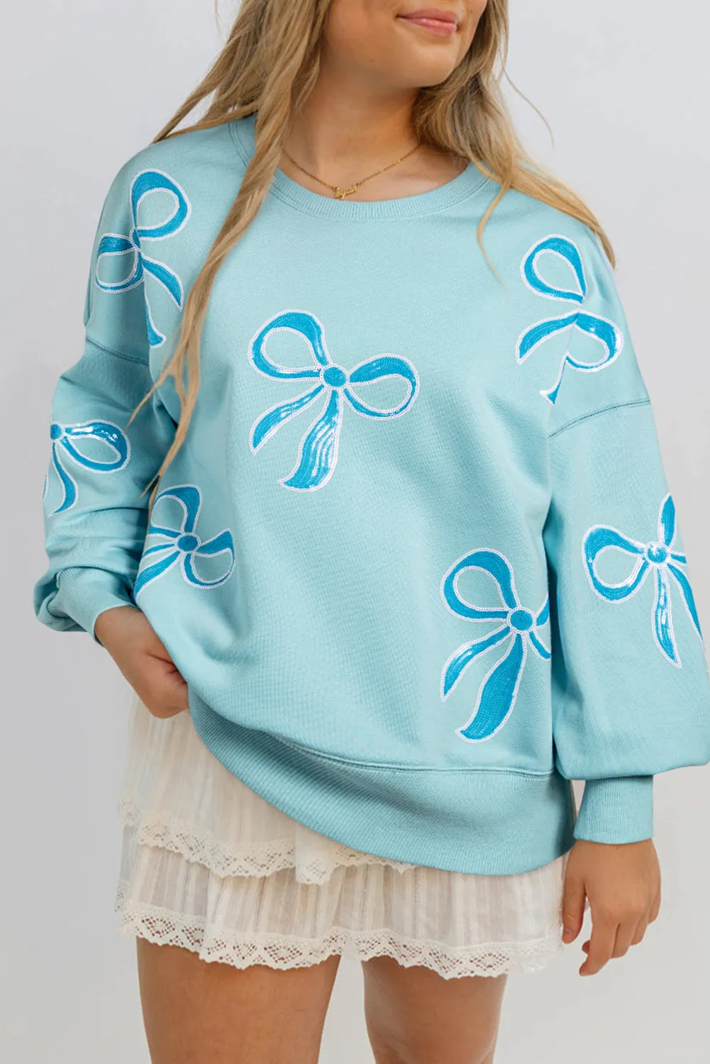 Beau Blue Sequined Bowknot Drop Shoulder Oversized Sweatshirt sold by Beagle Boutique