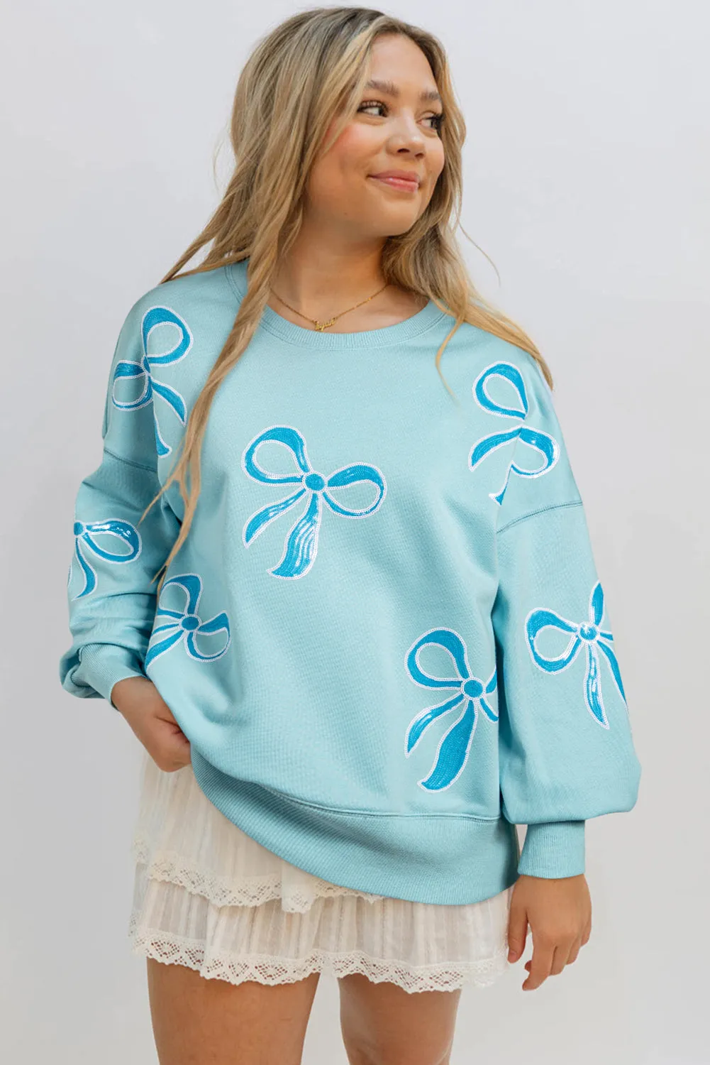 Beau Blue Sequined Bowknot Drop Shoulder Oversized Sweatshirt sold by Beagle Boutique product image thumbnail 3