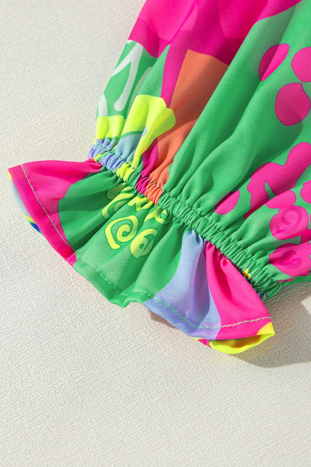 Black Abstract Print Ruffled Sleeve Buttoned V Neck Blouse sold by Beagle Boutique product image thumbnail 5