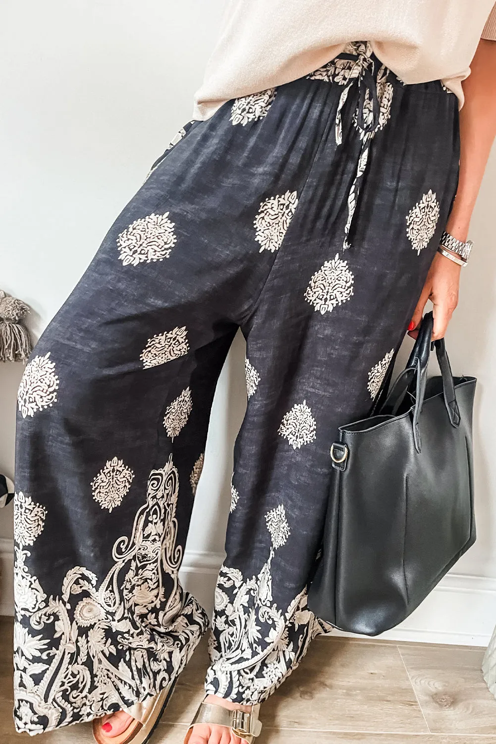 Black Bohemian Printed Drawstring Waist Wide Leg Trousers sold by Beagle Boutique