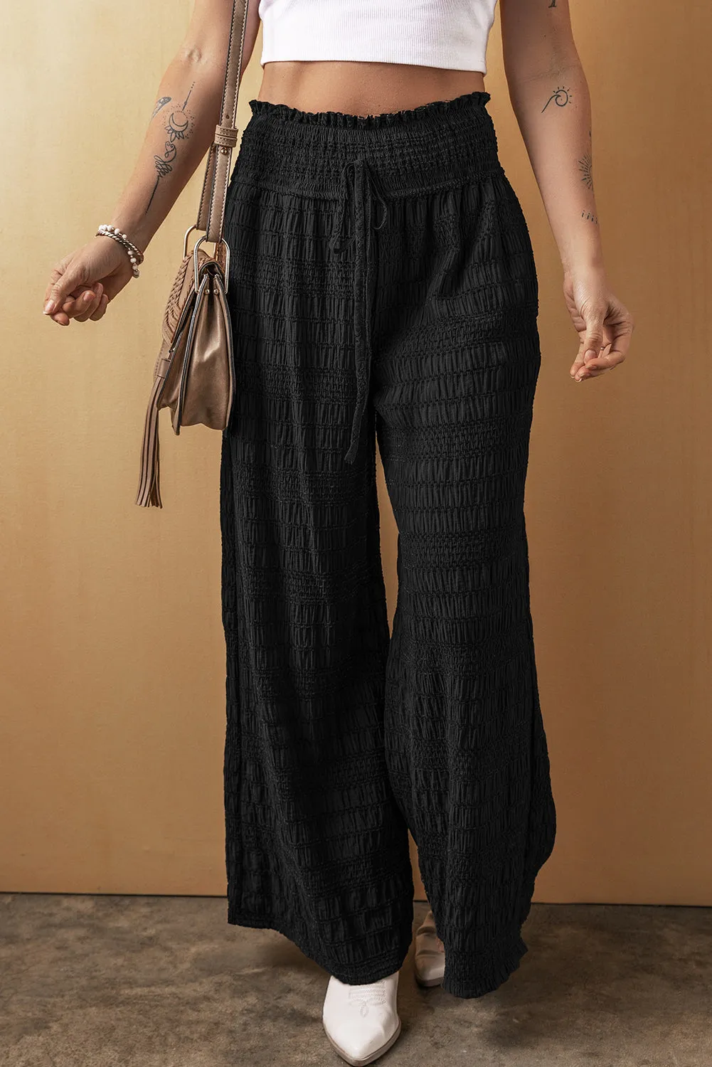 Black Textured Wide Smocked Waist Loose Trousers sold by Beagle Boutique