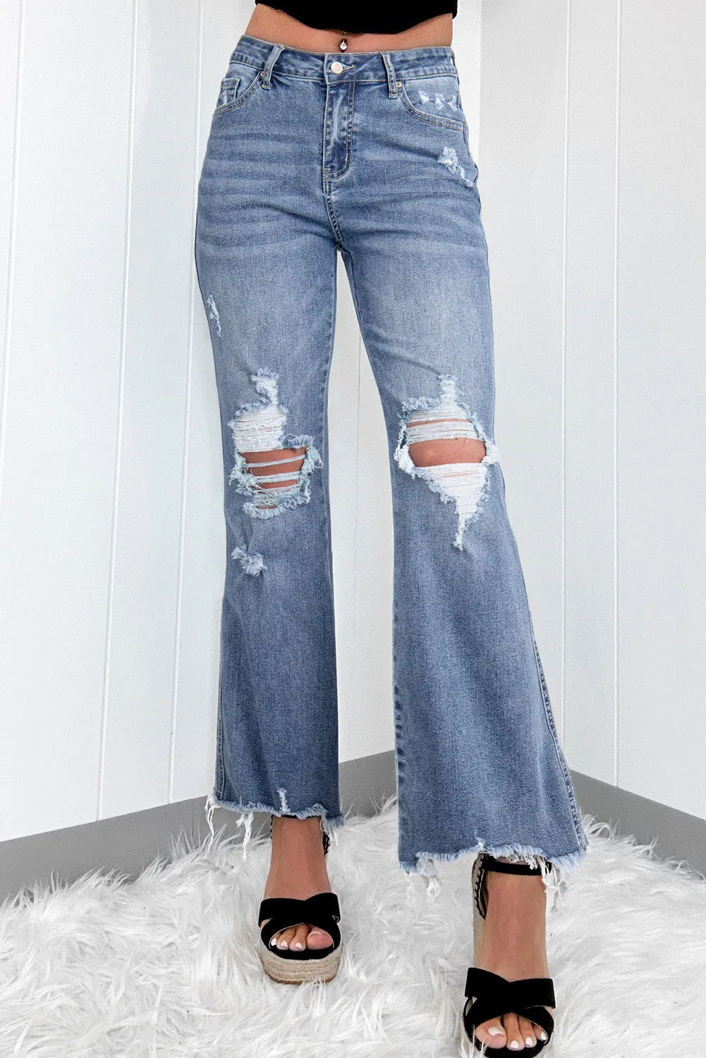 Dusk Blue High Rise Ripped Distressed Hem Flared Jeans sold by Beagle Boutique
