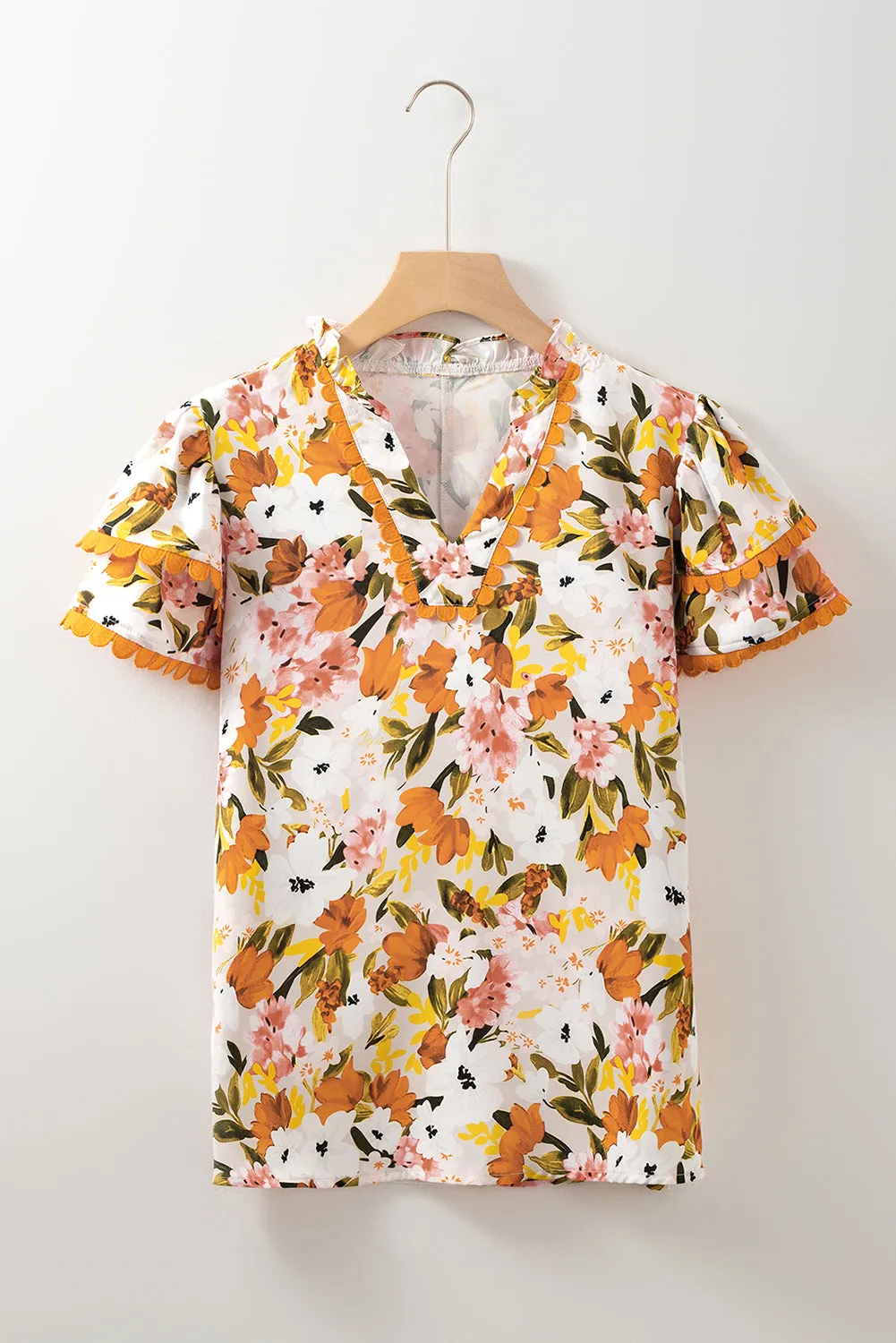 Russet Orange Ruffled V Neck Scalloped Short Sleeve Floral Blouse sold by Beagle Boutique product image thumbnail 4