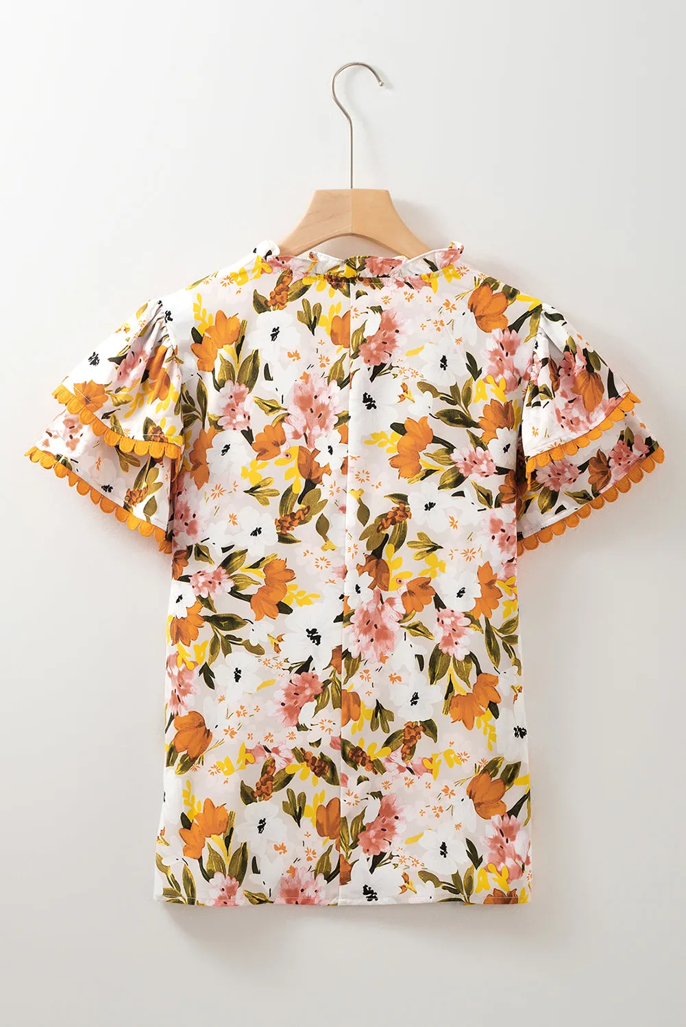 Russet Orange Ruffled V Neck Scalloped Short Sleeve Floral Blouse sold by Beagle Boutique product image thumbnail 5