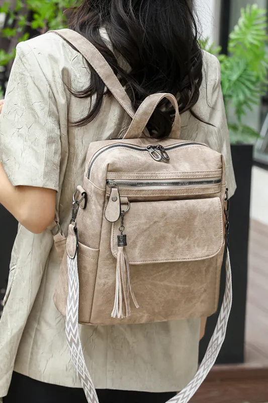 Parchment Multi-Pocket Tassel Geometric Printed Strap Backpack sold by Beagle Boutique