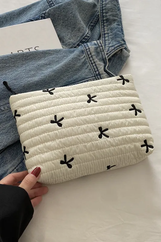 White Bow Quilted Makeup Bag sold by Beagle Boutique