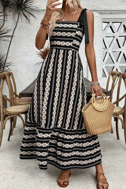 Black Geometric Striped Knot Strap Maxi Dress sold by Beagle Boutique