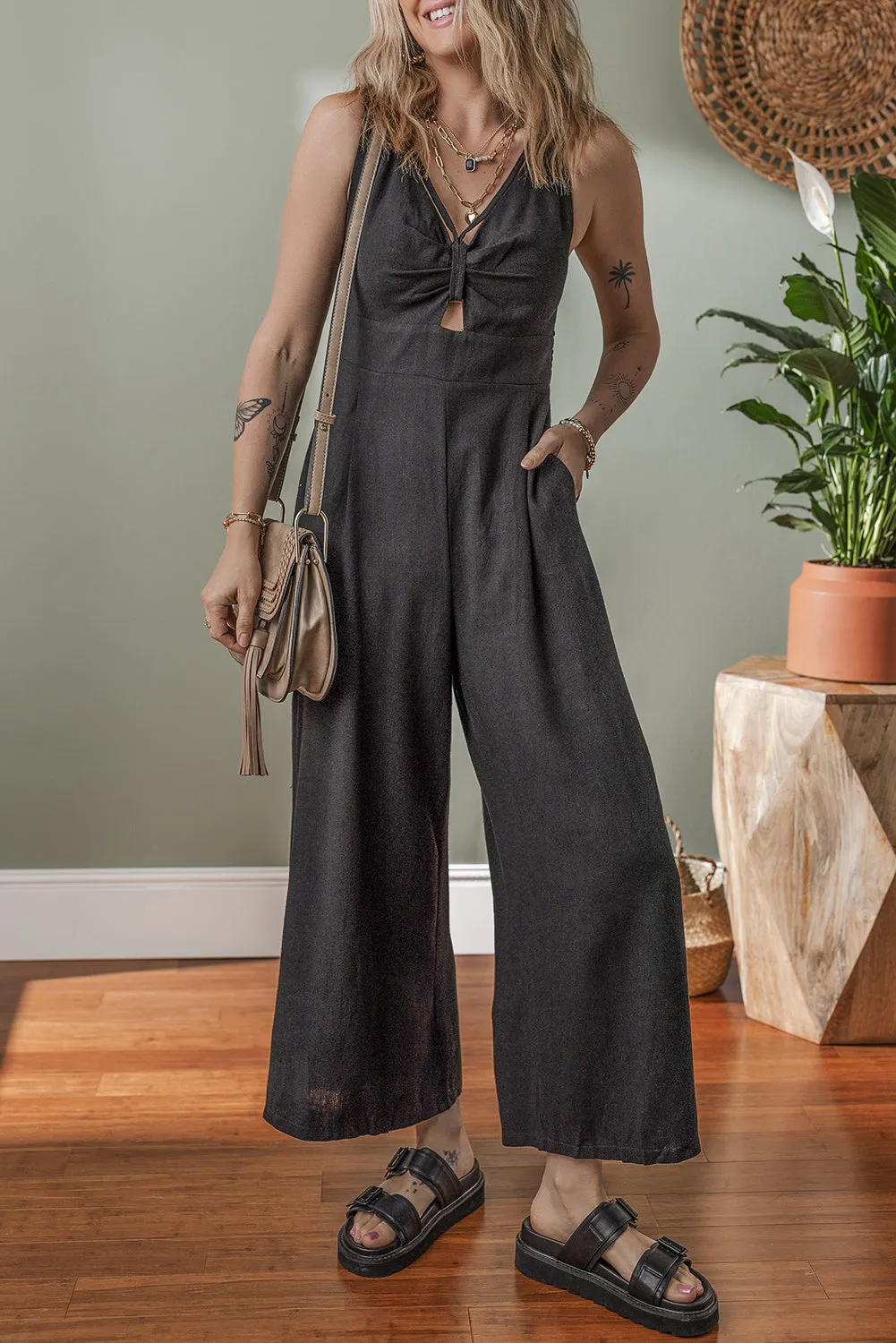 Black Front Cut Out Smocked Back Sleeveless Wide Leg Jumpsuit sold by Beagle Boutique