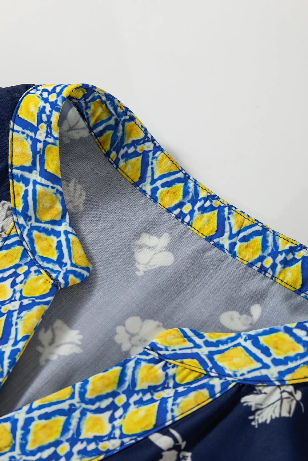 Blue Floral Print Half Sleeve Contrast Trim V Neck Blouse sold by Beagle Boutique product image thumbnail 5