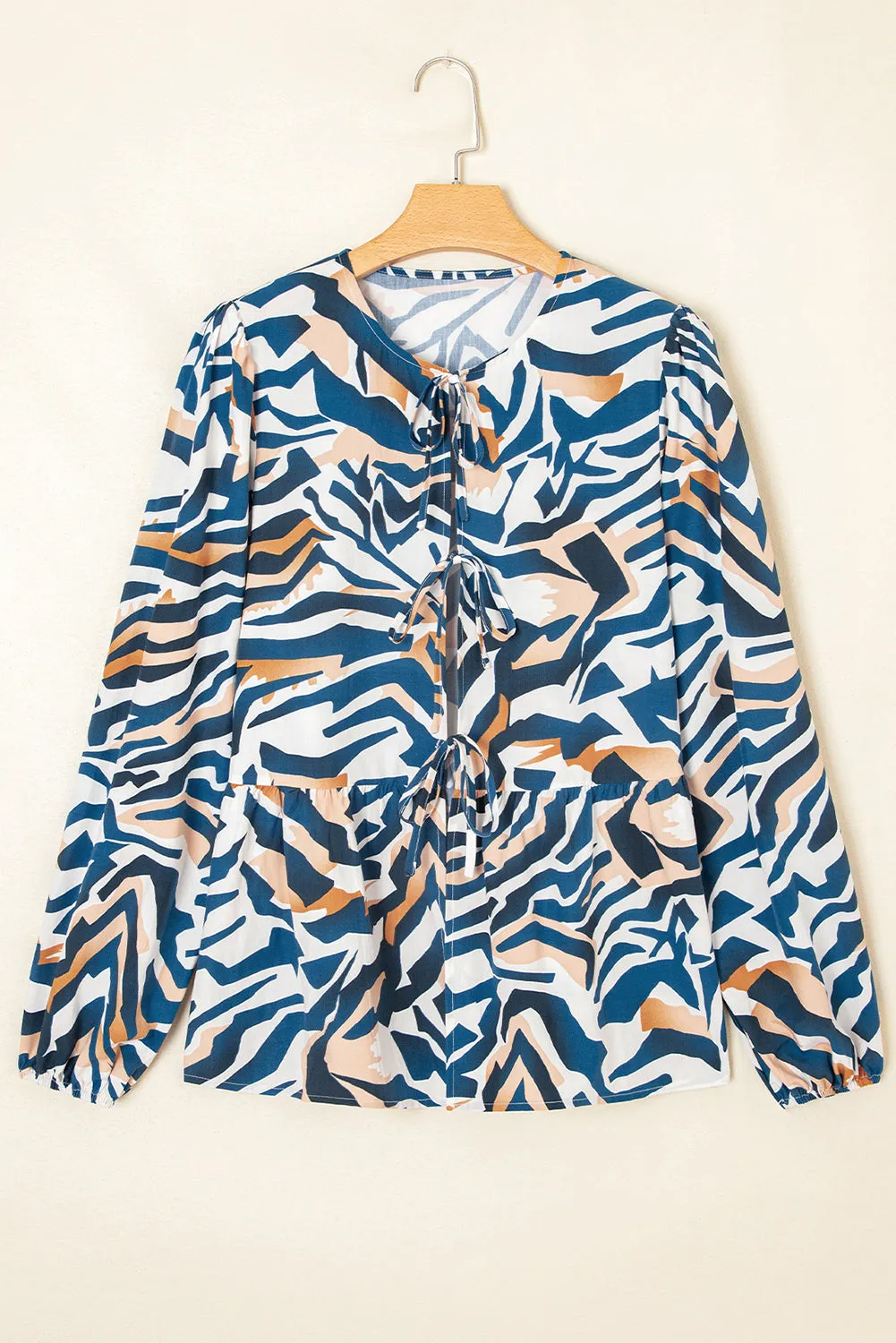 Zebra Print Tied Front Puff Sleeve Top sold by Beagle Boutique