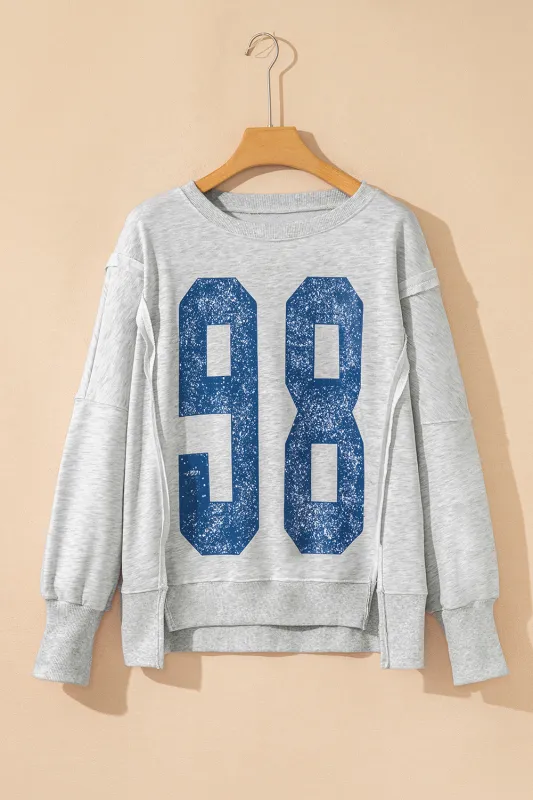 Grey Faded Varsity Print Loose Pullover Top sold by Beagle Boutique